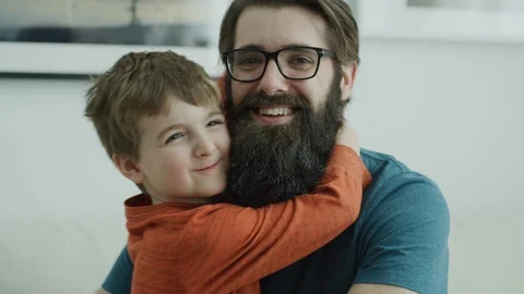 Close up portrait of smiling son hugging father and looking at camera / Lehi, Stock Footage 108193541