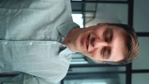 Close-up portrait of smiling young man making selfie or video call while sitting Stock Footage 156550080