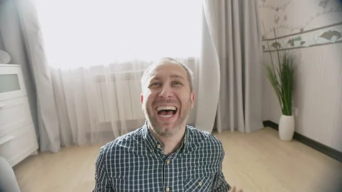 Close up portrait of smiling young man laughing Stock Footage 159663339