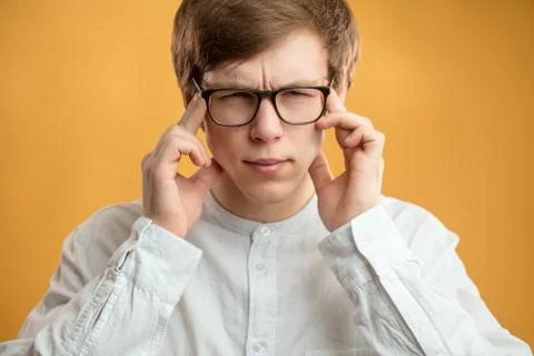 Close up portrait of student with bad memory. try to memorise facts,datas. Stock Photos