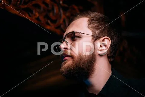 A close up portrait of a stylish man wearing glasses. Beauty and style for me Stock Photos
