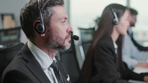 Close Up Portrait of a Technical Customer Support Specialist Talking on a Stock Footage 168683824