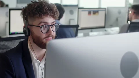 Close Up Portrait of a Technical Customer Support Specialist Talking on a Stock Footage 168970302