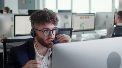 Close Up Portrait of a Technical Customer Support Specialist Talking on a Stock Footage 168970834
