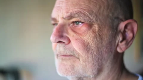 Close-Up Portrait of a Thoughtful Senior Man Wearing Glasses Stock Footage 312537553