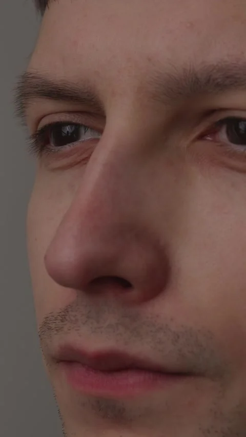 Close up portrait of a thoughtful young man looking away into distance Stock Footage 335082323