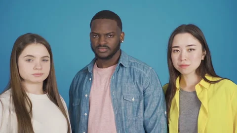 Close-up portrait of three multiethnic people. Different race and ethnicity. Video stock 228810653