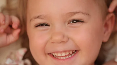 Close-up portrait of a three years old smiling happy girl. Stock Footage
