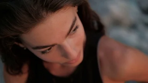 Close-up portrait from top to bottom of passionate brunette woman who stares and Video stock 81179620