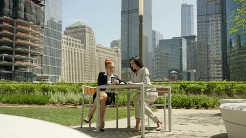 Close-up portrait of two beautiful concentrated business women taking selfie and Stock Footage 155946796