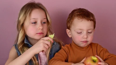Close-up portrait of two charming cheerful beautiful children Stock Footage 127703215