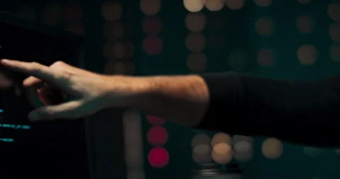 A close-up portrait of two hackers analyzing the code of malware that they will Stock Footage 146099840
