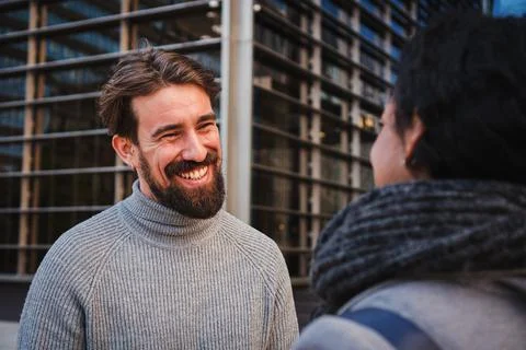 Close up portrait of two smart multiethnic business people conversing together Stock Photos