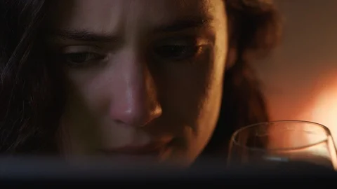 Close up portrait unhappy woman crying watching sad movie using tablet computer Stock Footage 99797953