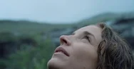 Close Up Portrait Of Woman Looking Up At Rain In Nature With Wet Hair  Hiker Stock Footage