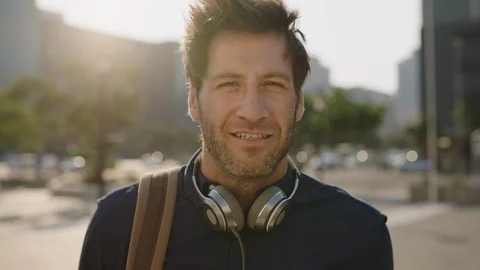 Close up portrait of young attractive caucasian man looking confident smiling at Stock Footage