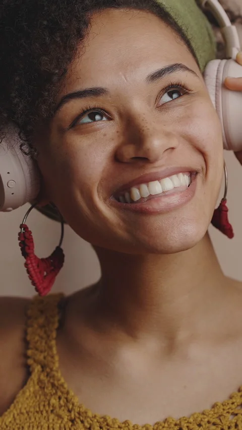 Close up portrait of young authentic beautiful stylish black woman listening to Stock Footage 328608628