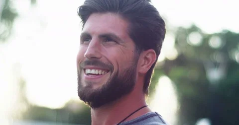 Close up portrait young bearded man in sunglasses on sunset background sunrise Stock Footage 81686567