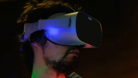 Close-up portrait of young bearded man in virtual reality glasses. Видео 101431973