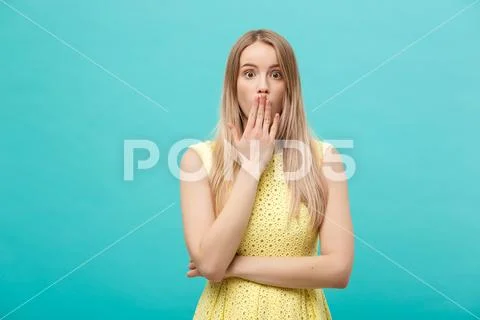 Close up Portrait young beautiful attractive girl shocking with something. Blue Stock-Fotos