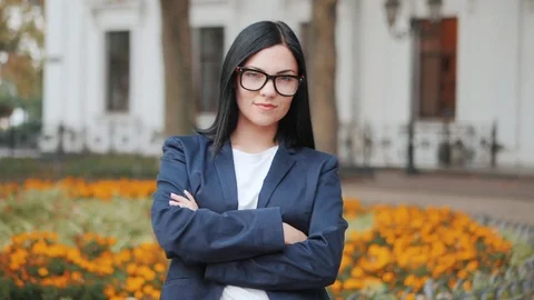 Close-up portrait of young beautiful businesswoman looking at camera with smile Stock Footage