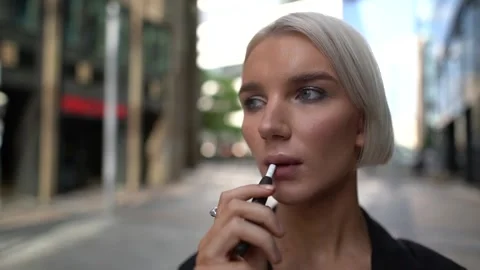A close-up portrait of a young, businesslike, elegant girl with short white hair Stock-Footage 134921082