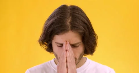 Close up portrait of young desperate man regretting his wrongdoing, hiding his Stock Footage 144649803