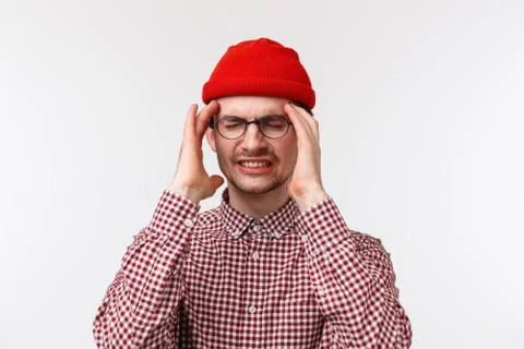Close-up portrait of young guy feeling sick after party and few drinks, wake up Stock Photos