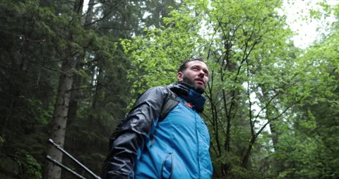 Close-up portrait of a young happy bearded man walking Stock Footage 243721596