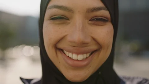 Close up portrait of young happy muslim business woman wearing hijab headscarf Stock Footage