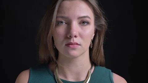 Close-up portrait of young long-haired brunette caucasian girl watching Video stock 102982913