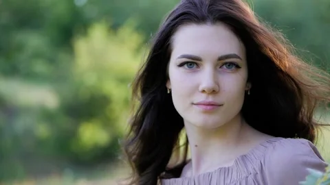 Close up portrait of young long-haired brunette caucasian girl Stock Footage 113146818