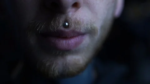 Close-up portrait of young man with piercing, demonstrating splitted tongue Stock Footage 123029980