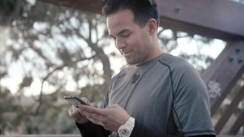Close up portrait of young man using smartphone surprised, upset, disappointed Stock Footage 104489900