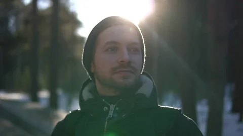 Close up portrait of young man in a winter wood Stock Footage 93324384