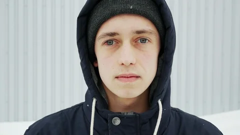 Close up portrait of a young man in the winter city with eye injury, hemorrhage Stock Footage 102061887