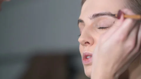 Close up portrait of young model during the make up process. Video stock 121512110