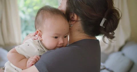 Close up portrait young mother hold in Stock Video Pond5