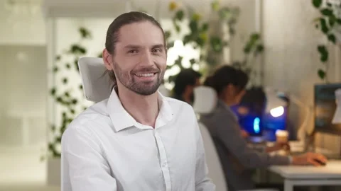 Close-up portrait of young qualified programmer working in IT company coding on Stock Footage 228979996