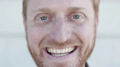 Close up portrait of young red haired man smiling at camera Stock Footage 193153341