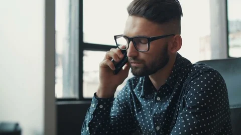 Close up portrait of a young software engineer developer speaks by phone, angry Stock Footage 81176027