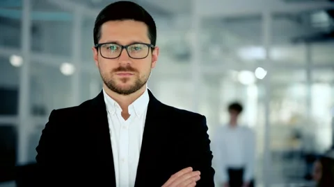 Close up portrait of young startup founder standing at office room and looking Stock Footage 251804210