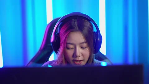 Close up portrait of the Young woman Pro Gamer Playing in Online Video Game Stock Footage 134446341