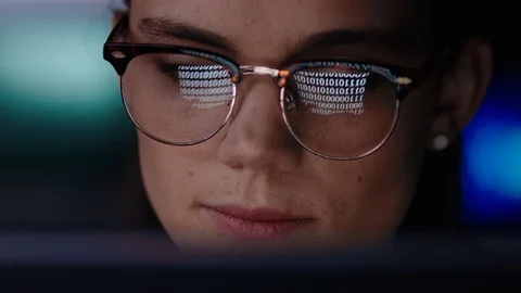 Close up portrait young woman programmer using computer browsing code data Stock Footage 99805355