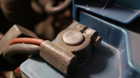 Close-Up of Positive Car Battery Terminal Connected with Red Cable in Engine Stock Footage 335643705