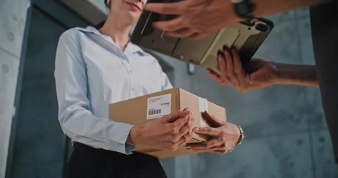 Close Up of Postman Delivering Parcel Box to Addressee, Getting Clients Stock Footage 312382310