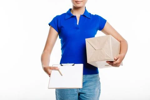 Close up of the postman with the parcel under her hand. Stock Photos