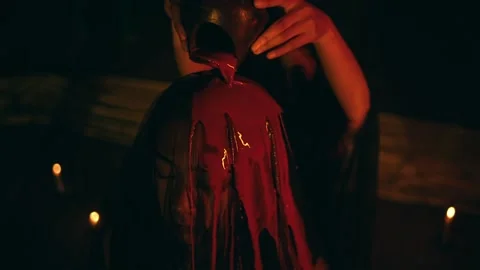 Close-Up of Pot About to Pour Liquid in Dark Ritual (Suspense). Stock Footage 232904714