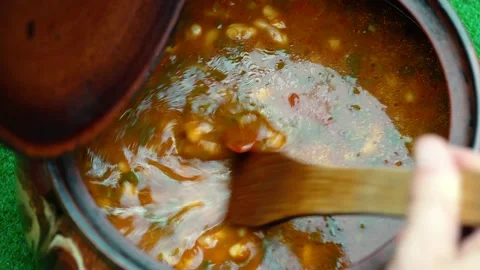 Close Up, Of A Pot of beans Soup Of  While Being Stirred. Stock Footage 130372092