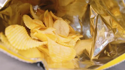 Close up potato chip inside foil bag Stock Footage 261185794